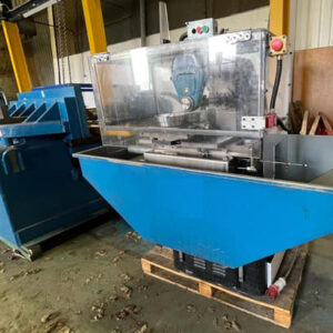 Win Win company’s Adcock Shipley 1ES milling machine in a factory setting, featuring a compact blue design with safety shielding and manual controls, ideal for precision industrial milling tasks.