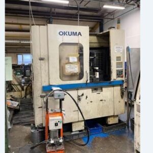 Okuma MA-40HA Twin Pallet Horizontal Machining Centre in a clean workshop environment, featuring a beige and blue body with a front viewing window and integrated control panel.