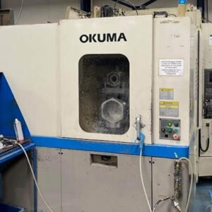Okuma MA-40HA Twin Pallet Horizontal Machining Centre in a clean workshop environment, featuring a beige and blue body with a front viewing window and integrated control panel.