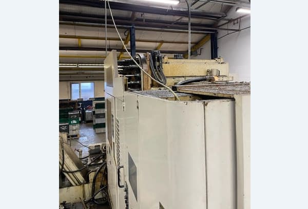 Okuma MA-40HA Twin Pallet Horizontal Machining Centre in a clean workshop environment, featuring a beige and blue body with a front viewing window and integrated control panel.