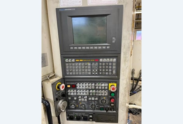 Okuma MA-40HA Twin Pallet Horizontal Machining Centre in a clean workshop environment, featuring a beige and blue body with a front viewing window and integrated control panel.