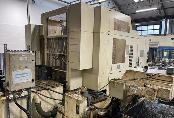 Okuma MA-40HA Twin Pallet Horizontal Machining Centre in a clean workshop environment, featuring a beige and blue body with a front viewing window and integrated control panel.