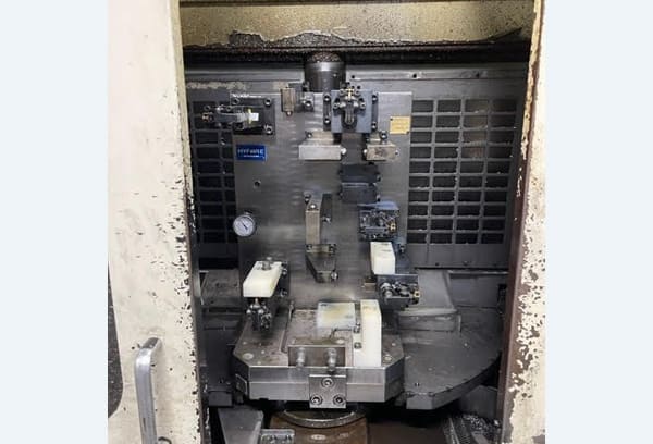 Okuma MA-40HA Twin Pallet Horizontal Machining Centre in a clean workshop environment, featuring a beige and blue body with a front viewing window and integrated control panel.