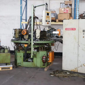 Win Win company’s RID 154G12 rotary transfer machine in an industrial facility, featuring multiple machining stations arranged in a circular configuration for automated, high-volume production processes