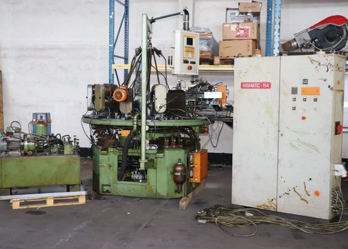 Win Win company’s RID 154G12 rotary transfer machine in an industrial facility, featuring multiple machining stations arranged in a circular configuration for automated, high-volume production processes