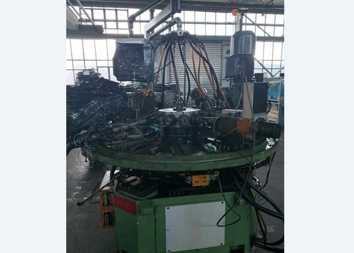 Win Win company’s RID 154G12 rotary transfer machine in an industrial facility, featuring multiple machining stations arranged in a circular configuration for automated, high-volume production processes