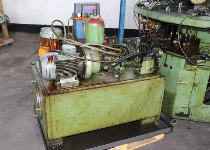 Win Win company’s RID 154G12 rotary transfer machine in an industrial facility, featuring multiple machining stations arranged in a circular configuration for automated, high-volume production processes