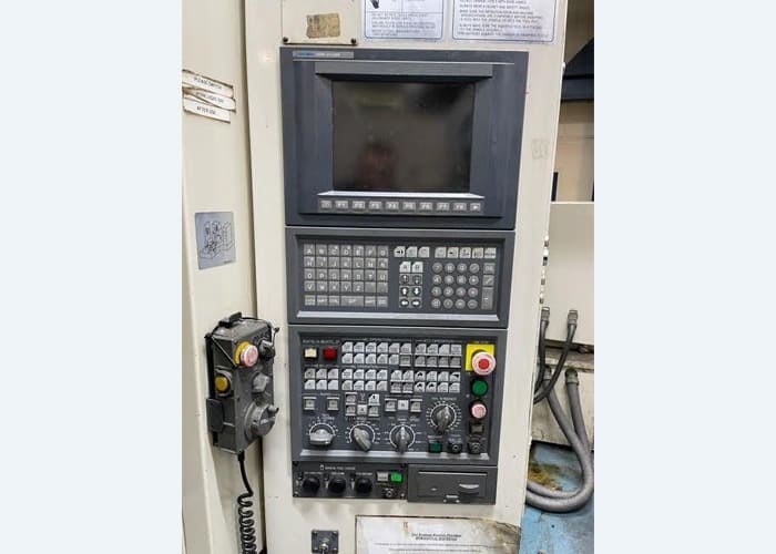 Okuma MA-40HA Twin Pallet Horizontal Machining Centre in a clean workshop environment, featuring a beige and blue body with a front viewing window and integrated control panel.