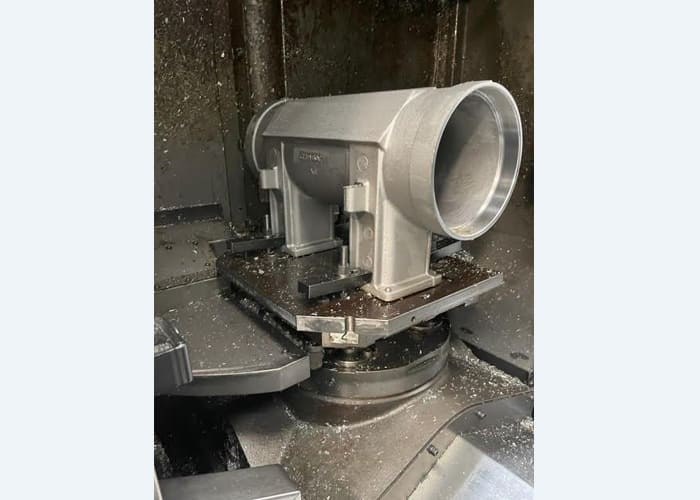 Okuma MA-40HA Twin Pallet Horizontal Machining Centre in a clean workshop environment, featuring a beige and blue body with a front viewing window and integrated control panel.