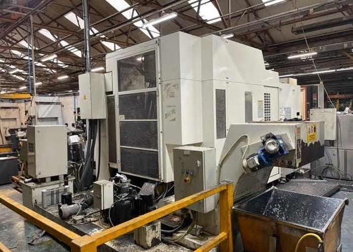 Okuma MA-40HA Twin Pallet Horizontal Machining Centre in a clean workshop environment, featuring a beige and blue body with a front viewing window and integrated control panel.